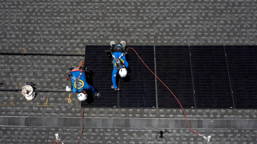 Workers install solar panels during a SunPower installation on a home in Napa, California, US, on Monday, July 17, 2023.