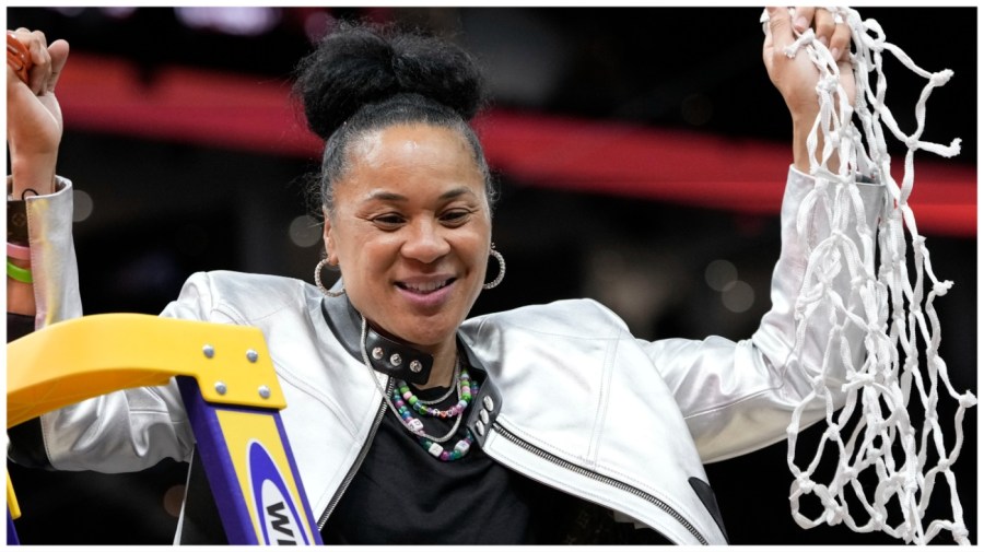 South Carolina head coach Dawn Staley cuts down the net after the Final Four college basketball championship game against Iowa in the women's NCAA Tournament, Sunday, April 7, 2024, in Cleveland. South Carolina won 87-75. (AP Photo/Morry Gash)