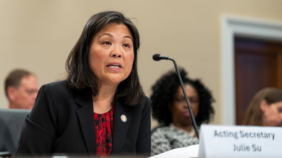 Secretary of Labor Julie Su speaks during a congressional hearing.