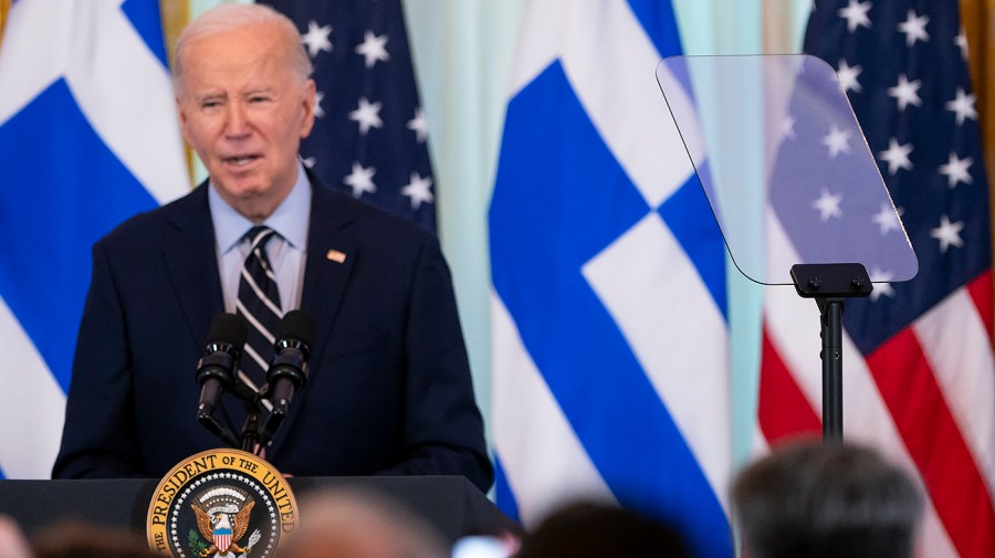 President Biden speaks during a reception.