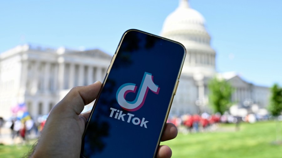 In this photo illustration logo of TikTok is displayed on a mobile phone screen in front of The White House in Washington DC, United States on April 20, 2024.