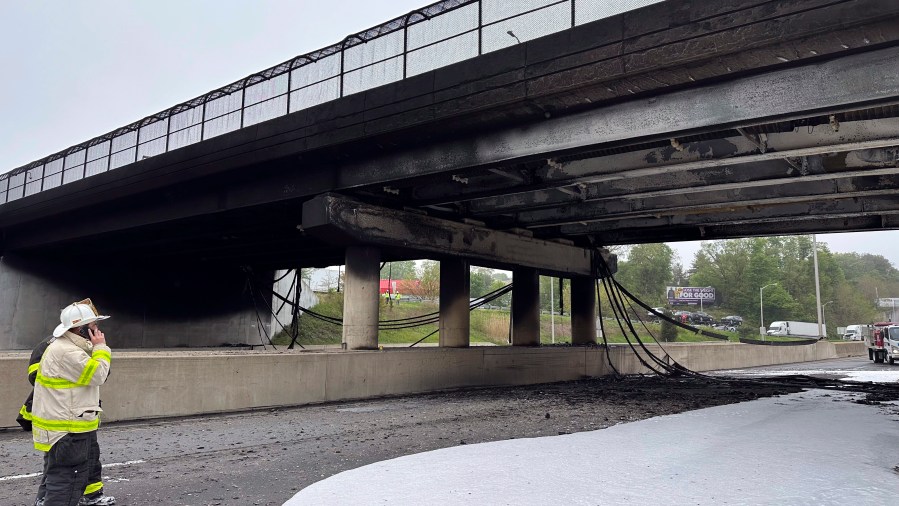 In this image provided by the Connecticut Governor's Office, emergency personnel work at the scene of a fiery early morning crash that left both sides of Interstate 95, the East Coast’s main north-south highway, shut down in southwestern Connecticut., Thursday, May 2, 2024, in Norwalk, Conn. (Norwalk Fire Department/Connecticut Governor's Office via AP)