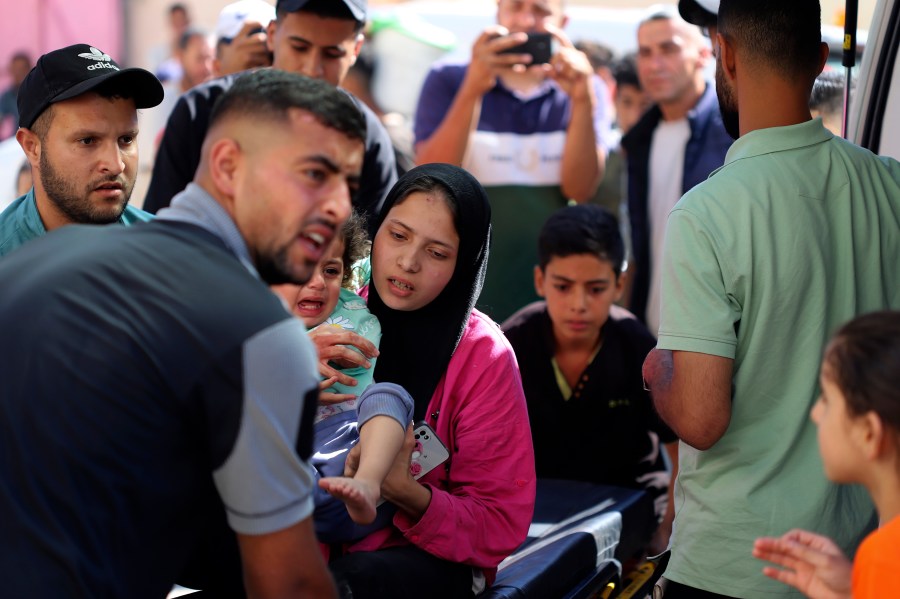 A Palestinian child is brought to the Kuwaiti Hospital after being wounded in the Israeli bombardment of the Gaza Strip, in Rafah refugee camp, southern Gaza, Tuesday, May 7, 2024. (AP Photo/Ramez Habboub)