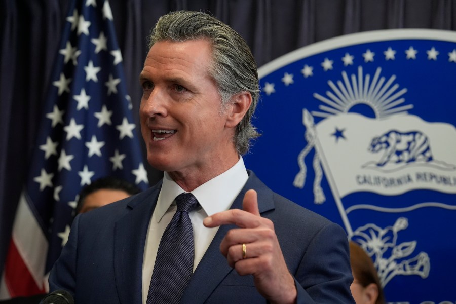 FILE - California Gov. Gavin Newsom during a news conference, March 21, 2024, in Los Angeles. California announced Thursday, May 9, 2024, it is partnering with five companies to develop generative AI tools to help deliver public services. (AP Photo/Damian Dovarganes, File)