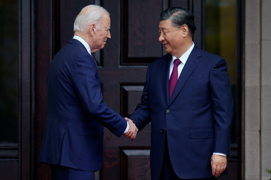 FILE - President Joe Biden, left, greets China's President President Xi Jinping, right, in Woodside, USA, Nov. 15, 2023. High-level envoys from the United States and China are set to meet in Geneva for talks about artificial intelligence including the risks of the technology and ways to set shared standards to manage it. The meeting Tuesday is billed as an opening exchange of views in an inter-governmental dialogue on AI agreed during a meeting between U.S. President Joe Biden and Chinese President Xi Jinping in San Francisco. (Doug Mills/The New York Times via AP, Pool, File)