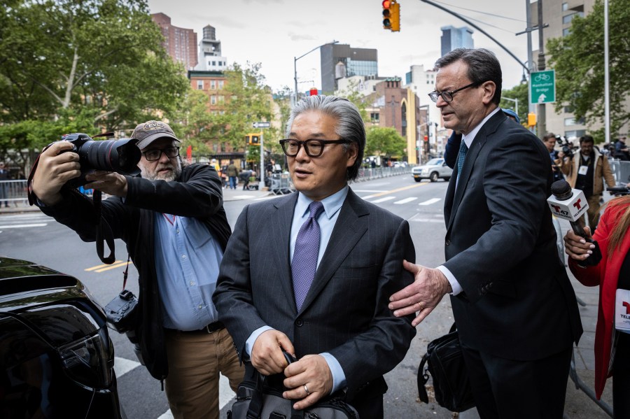 Bill Hwang, founder of Archegos Capital Management, center, leaves Manhattan federal court after the first day of his corruption trial, Monday, May, 13, 2024, in New York. (AP Photo/Stefan Jeremiah)