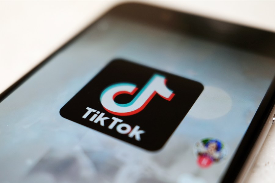 FILE - The TikTok logo is displayed on a smartphone screen in Tokyo on Sept. 28, 2020. TikTok says it's going to start automatically labeling content that's made by artificial intelligence when it's uploaded from certain platforms. TikTok says its efforts are an attempt to combat misinformation from being spread on its social media platform. The announcement came on ABC's “Good Morning America” on Thursday, May 9, 2024. (AP Photo/Kiichiro Sato, File)