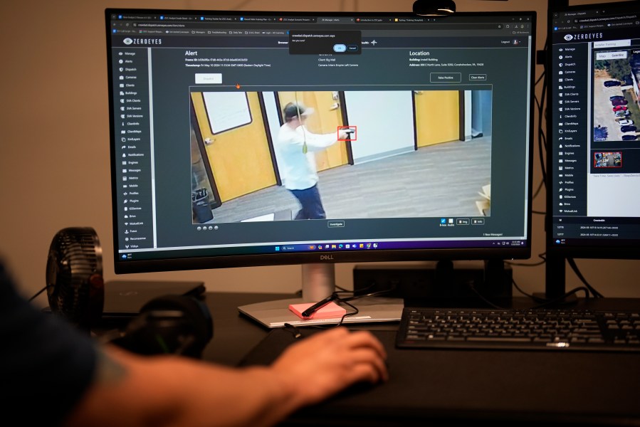 FILE - ZeroEyes analyst Mario Hernandez demonstrates the use of artificial intelligence with surveillance cameras to identify visible guns at the company's operations center, Friday, May 10, 2024, in Conshohocken, Pa. Kansas Gov. Laura Kelly vetoed a measure Wednesday, May 15, that could have earmarked up to $5 million for gun-detection systems in schools while expressing concern that it could have benefitted only ZeroEyes, a firm founded by military veterans which has lobbied lawmakers in various states to adopt its artificial-intelligence technology. (AP Photo/Matt Slocum, File)