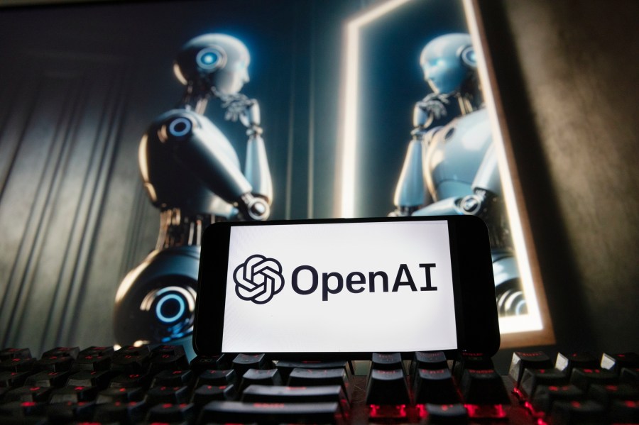 FILE - The OpenAI logo is seen displayed on a cell phone with an image on a computer monitor generated by ChatGPT's Dall-E text-to-image model, Friday, Dec. 8, 2023, in Boston. A former OpenAI leader who resigned from the company earlier this week said on Friday that product safety has "taken a backseat to shiny products" at the influential artificial intelligence company. (AP Photo/Michael Dwyer, file)