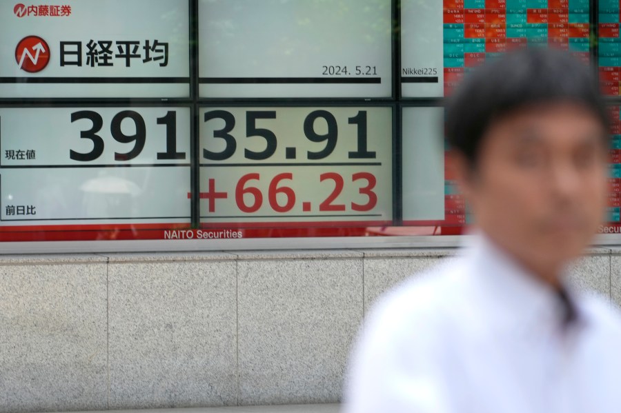 An electronic stock board showing Japan's Nikkei 225 index, is seen on the display of a securities firm Tuesday, May 21, 2024 in Tokyo. (AP Photo/Shuji Kajiyama)