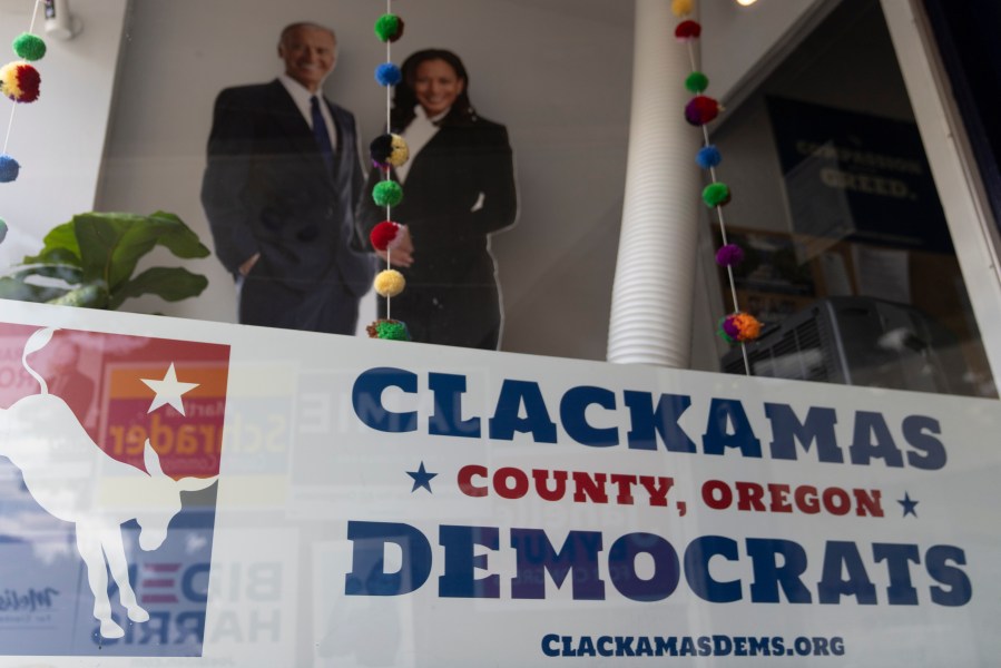 FILE - A sign is displayed at the Clackamas County Democratic party building, which is in Oregon's 5th Congressional District, May 17, 2024, in Oregon City, Ore. Ten jurisdictions have yet to weigh in on the presidential primaries even though Joe Biden and Donald Trump locked in their parties' nominations months ago. Voters Oregon, will get their chance on Tuesday, May 21. They will make symbolic decisions that provide a few more delegates to the national conventions and a gut check on where the Democratic and Republican bases stand toward their standard bearers. (AP Photo/Jenny Kane, File)