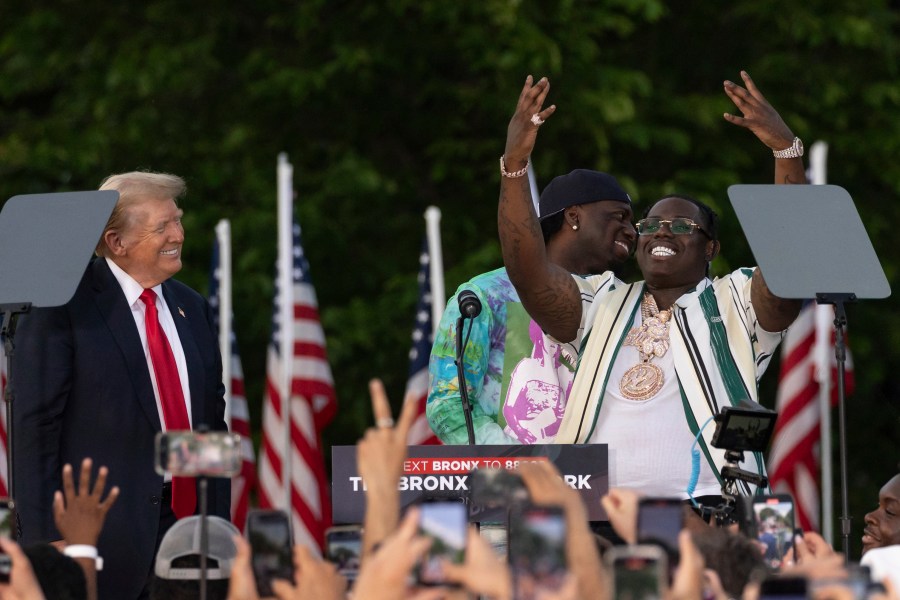 Rappers Sheff G, right, also known as Michael Williams, and Sleepy Hallow, center, also known as Tegan Chambers, join the Republican presidential candidate former President Donald Trump during a campaign rally in the south Bronx, Thursday, May. 23, 2024, in New York. (AP Photo/Yuki Iwamura)