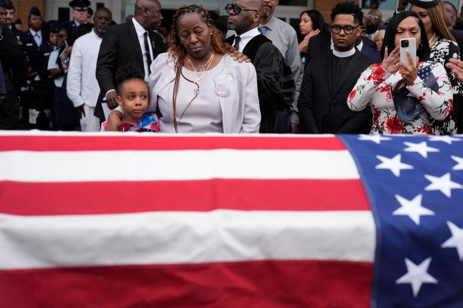 FILE - Chantemekki Fortson the mother of slain airman Roger Fortson, right, along with family watch Fortson's casket as they leave for a cemetery during his funeral at New Birth Missionary Baptist Church, Friday, May 17, 2024, in Stonecrest, Ga. (AP Photo/Brynn Anderson, File)