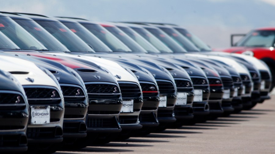 A line of unsold 2018 Cooper Clubmen sit in a long row at a Mini dealership, March 30, 2018, in Highlands Ranch, Colo.