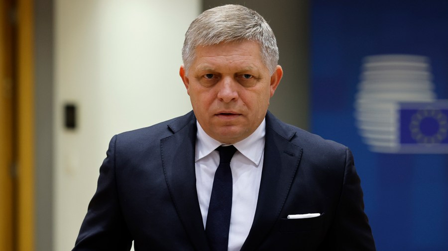 Slovakia's Prime Minister Robert Fico arrives at a meeting.