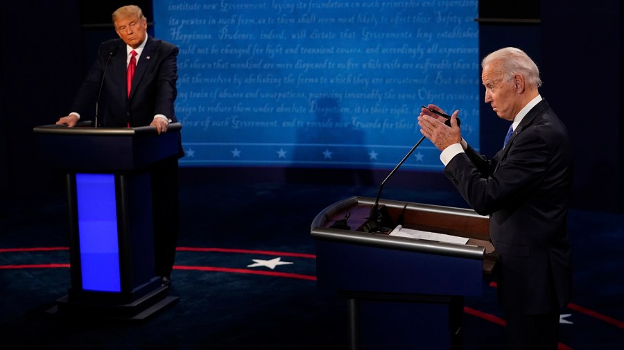 Then-President Trump and candidate Joe Biden are seen on stage during a debate.