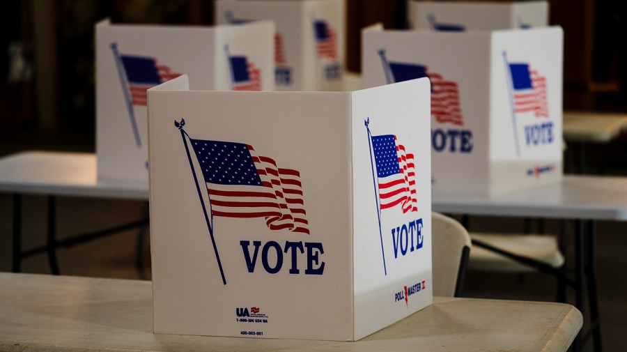 Voting booths are set up at a polling place.