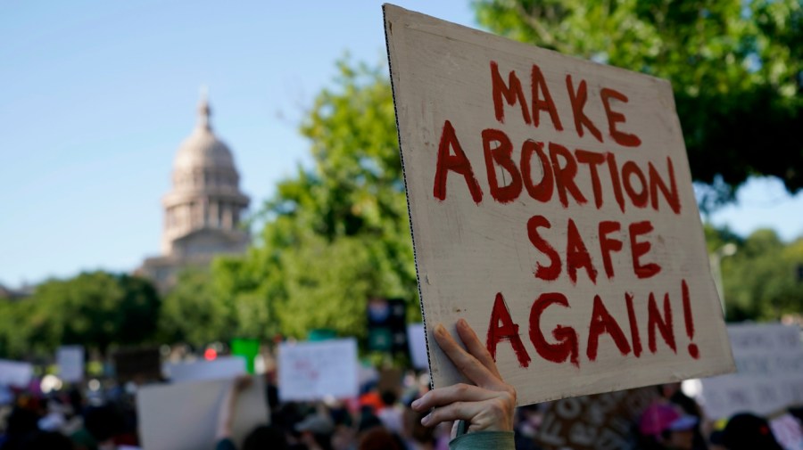 Demonstrators march and gather near the Texas Capitol following the U.S. Supreme Court's decision to overturn Roe v. Wade, June 24, 2022, in Austin, Texas.