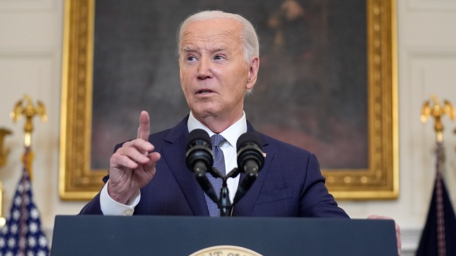 President Biden points while delivering remarks.