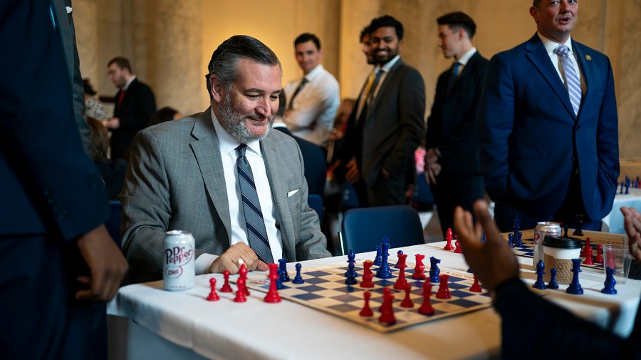 Sen. Ted Cruz (R-Texas) reacts to Grandmaster chess champion Maurice Ashley getting checkmate