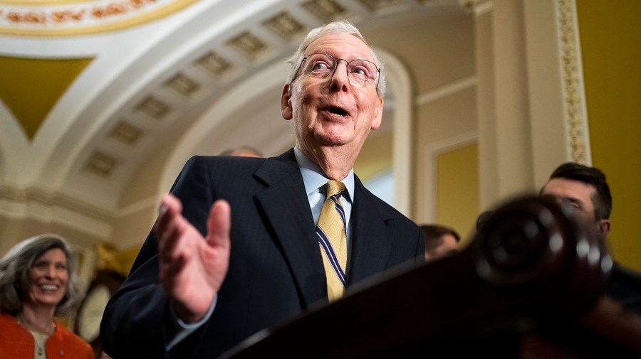 Minority Leader Mitch McConnell (R-Ky.) laughs as a question from CNN’s Manu Raju about the election