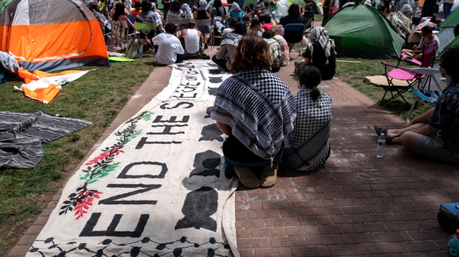 Activists and students gather for a meeting in the center of an encampment at University Yard at George Washington University on May 3, 2024 in Washington, DC.