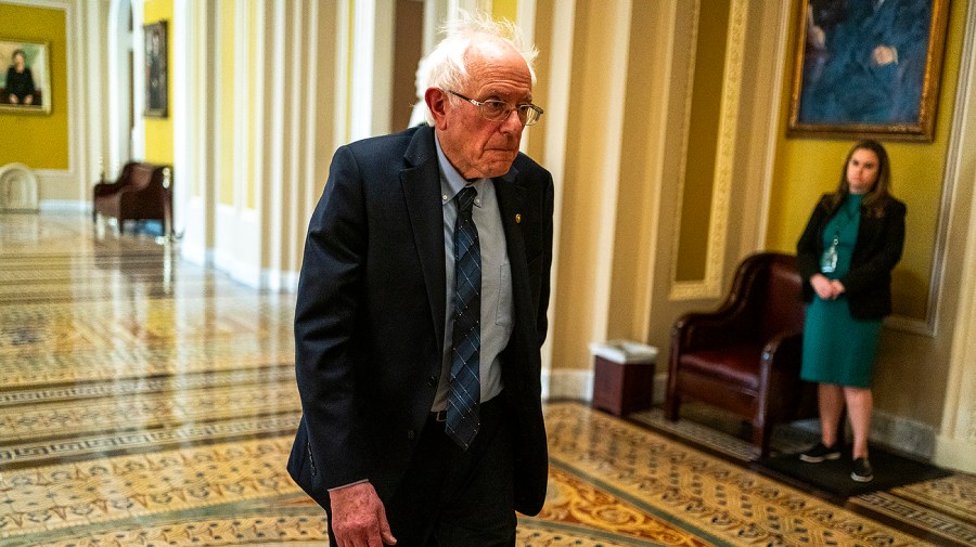 Senator Bernie Sanders walks near the Senate Chamber.