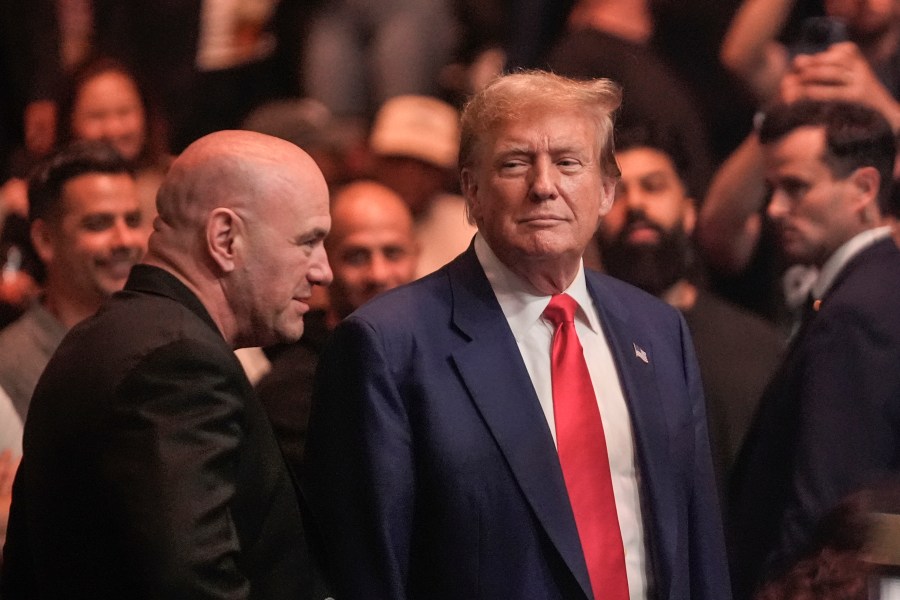 Former President Donald Trump, right, talks to Dana White while attending the UFC 302 mixed martial arts event Saturday, June 1, 2024, in Newark, N.J. (AP Photo/Frank Franklin II)