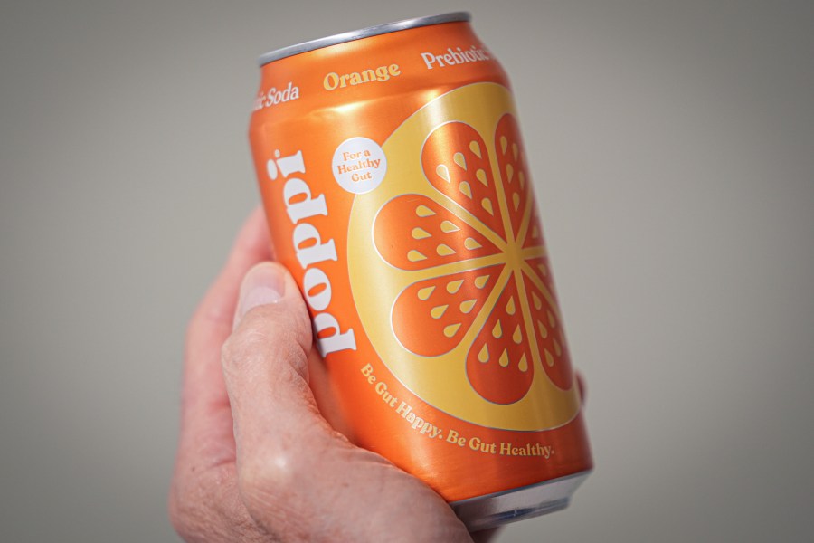 FILE - A can of Poppi prebiotic soda is shown on April 10, 2024, in New York. Soda brand Poppi is being sued by a consumer who says the brand isn't improving gut health as much as it claims. (AP Photo/John Minchillo, File)