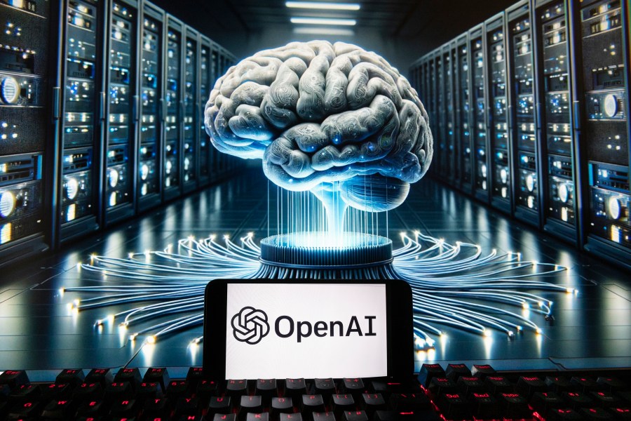 FILE - The OpenAI logo is seen displayed on a cell phone with an image on a computer monitor generated by ChatGPT's Dall-E text-to-image model, Dec. 8, 2023, in Boston. A group of OpenAI's current and former workers is calling on the ChatGPT-maker and other artificial intelligence companies to protect whistleblowing employees who flag safety risks about AI technology.(AP Photo/Michael Dwyer, File)