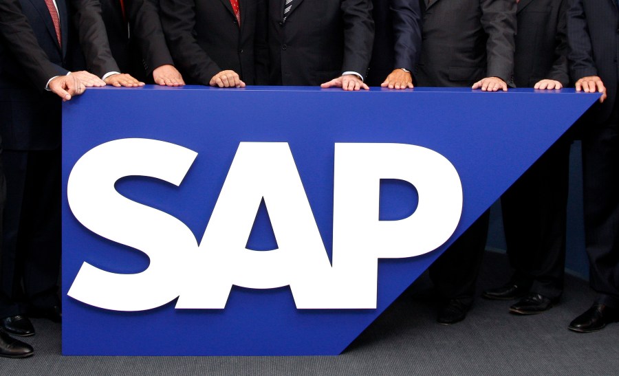 FILE - The board members of German software company SAP stand behind the company logo at its headquarters in Walldorf near Heidelberg, southwestern Germany, July 31, 2008. SAP has agreed to buy WalkMe in an all-cash deal valued at about $1.5 billion. (AP Photo/Daniel Roland, File)