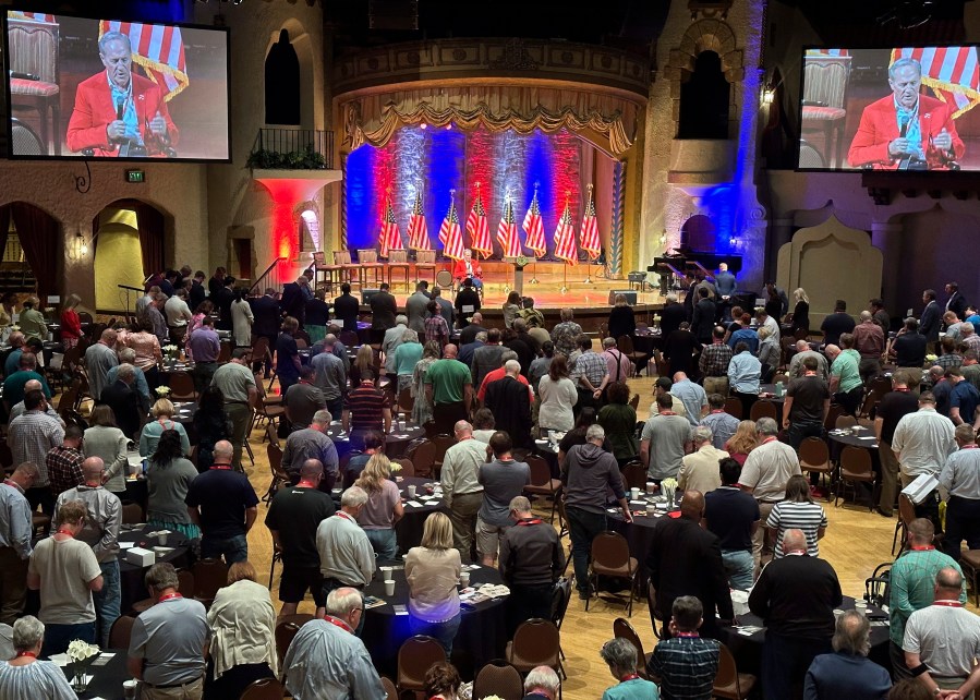 Evangelist Tim Lee leads audience members in prayer at the Life & Liberty Forum on Monday, June 10, 2024, in Indianapolis. The forum, put on by the institute, is expected to feature a taped message from former President Donald Trump, Southern Baptist leaders and others. (AP Photo/Peter Smith)