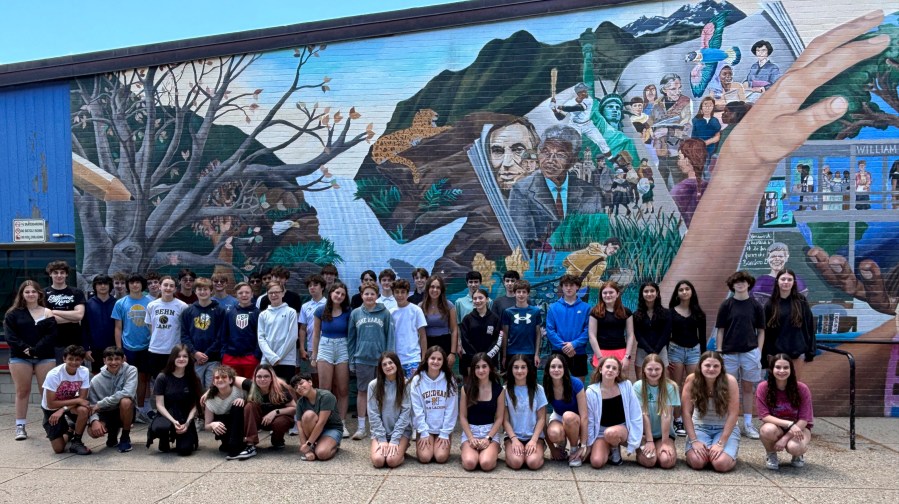 This image provided by Tamatha Bibbo, principal of the Pollard Middle School in Needham, Mass. on Wednesday, June 12, 2024 shows twenty-three sets of twins who graduated from the Pollard Middle School. They make up about 10% of the 8th grade class. (Tamatha Bibbo via AP)