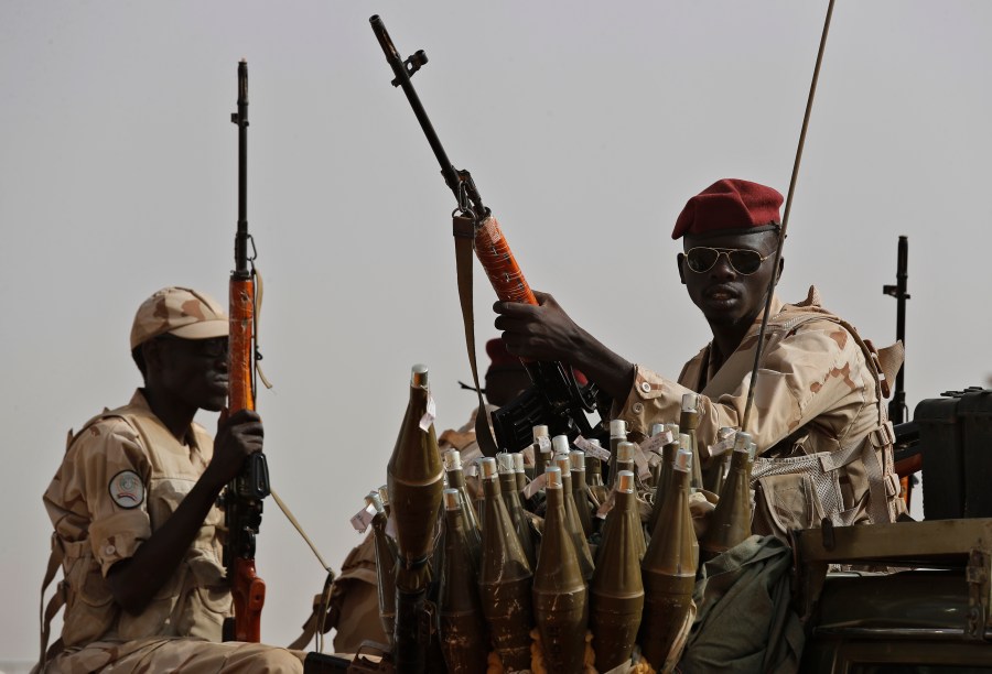 FILE - Sudanese soldiers from the Rapid Support Forces unit, led by Gen. Mohammed Hamdan Dagalo, the deputy head of the military council, secure the area where Dagalo attends a military-backed tribe's rally, in the East Nile province, Sudan, on June 22, 2019. The U.N. Security Council adopted a resolution Thursday, June 13, 2024, demanding that Sudan’s paramilitary force halt its siege of the only capital in the vast western region of Darfur that it doesn’t control where more than a million people are reportedly trapped. The resolution, which was approved by a vote of 14-0 with Russia abstaining, expresses “grave concern” at the spreading violence and credible reports that the paramilitary Rapid Support Forces are carrying out “ethnically motivated violence” in El Fasher. (AP Photo/Hussein Malla, File)