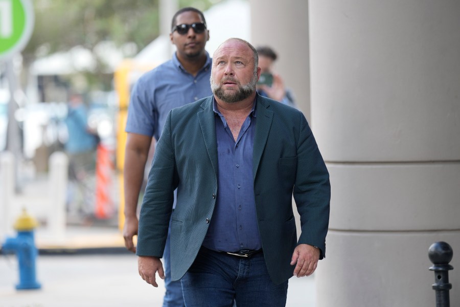 Right-wing conspiracy theorist Alex Jones returns to the federal courthouse for a hearing in front of a bankruptcy judge Friday, June 14, 2024, in Houston. The judge is expected to rule on whether to liquidate Jones' assets to help pay the $1.5 billion he owes for his false claims that the Sandy Hook Elementary School shooting was a hoax. (AP Photo/David J. Phillip)