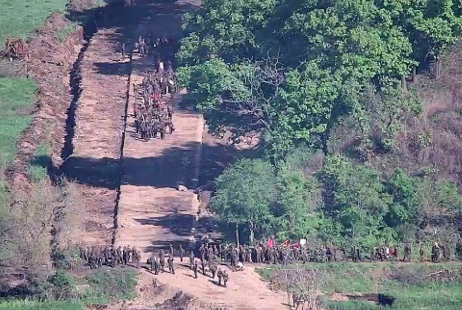 In this undated photo provided on Tuesday, June 18, 2024, by South Korea Defense Ministry, North Korean soldiers work at an undisclosed location near the border area, as seen from a South Korean guard area. South Korean soldiers fired warning shots to repel North Korean soldiers who temporarily crossed the rivals' land border Tuesday for the second time this month, South Korea's military said. (South Korea Defense Ministry via AP)