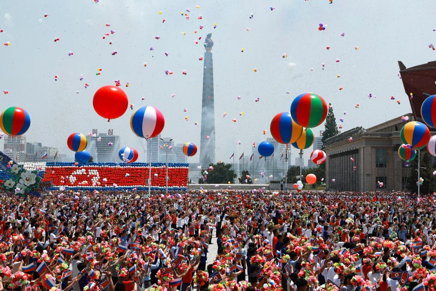 North Korea's people attend the official welcome ceremony with Russian President Vladimir Putin and North Korea's leader Kim Jong Un in the Kim Il Sung Square in Pyongyang, North Korea, on Wednesday, June 19, 2024. (Vladimir Smirnov, Sputnik, Kremlin Pool Photo via AP)