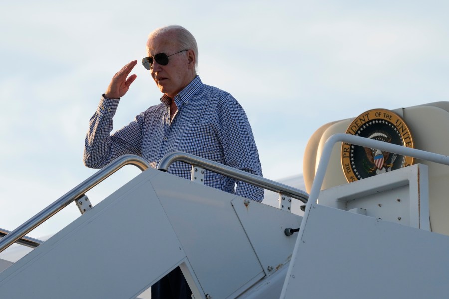 President Joe Biden salutes as he boards Air Force One at Dover Air Force Base, Del., Thursday, June 20, 2024. Biden spent a few days at his beach home in Rehoboth Beach, Del., before heading to Camp David to prepare for the upcoming presidential debate. (AP Photo/Susan Walsh)