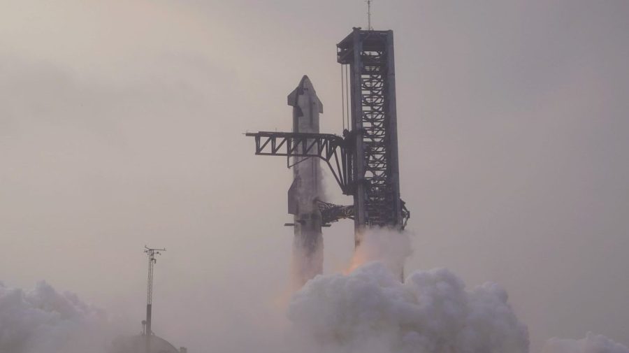 SpaceX's Starship rocket lifts off in a heavy haze.