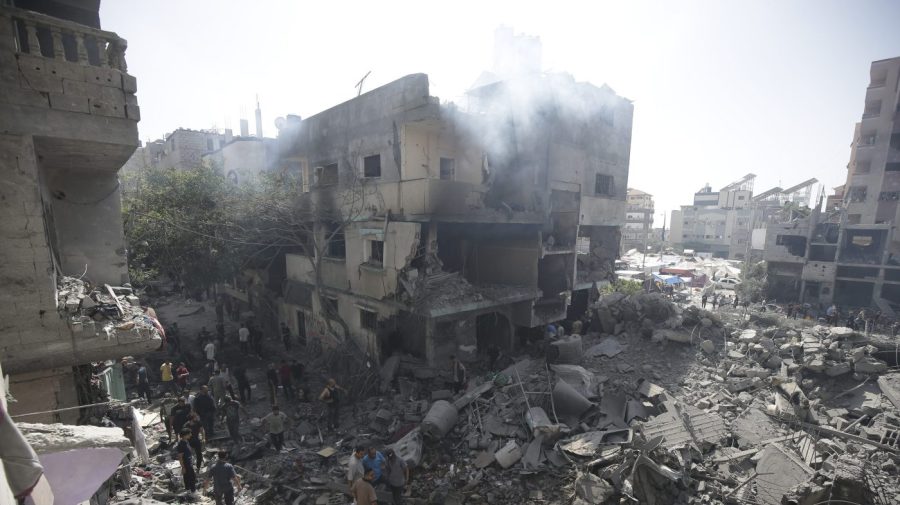 FILE - Palestinians look at the aftermath of the Israeli bombing in Nuseirat refugee camp, Gaza Strip, on June 8, 2024. (AP Photo/Jehad Alshrafi, File)