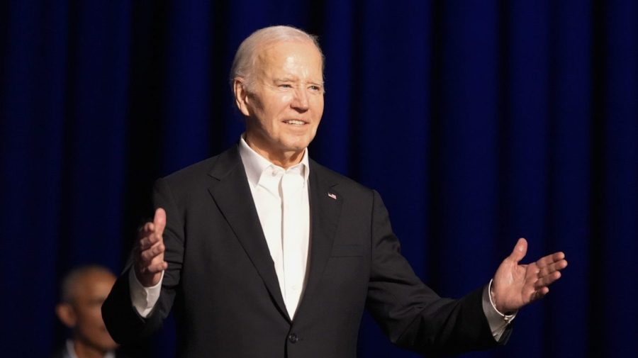 President Biden gestures as he arrives at a campaign event.