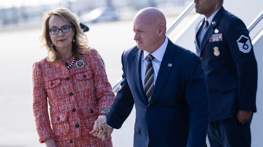 Gabby Giffords and Senator Mark Kelly disembark a plane.