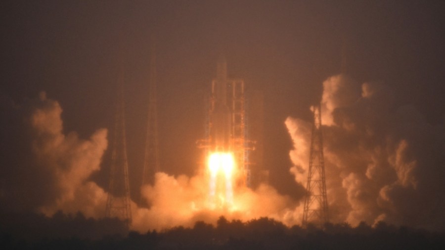 In this photo provided by China's Xinhua News Agency, a Long March-5 rocket, carrying the Chang'e-6 spacecraft, blasts off from its launchpad at the Wenchang Space Launch Site in Wenchang, south China's Hainan Province, Friday, May 3, 2024. China on Friday launched a lunar probe to land on the far side of the moon and return with samples that could provide insights into differences between the less-explored region and the better-known near side. (Guo Cheng/Xinhua via AP)