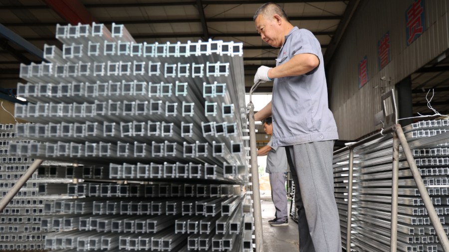 A worker is producing aluminum profile products at an aluminum profile production company in Binzhou, Shandong province, China, on June 5, 2024. Recently, the United States is releasing the results of the four-year review of the 301 tariffs on China, announcing that on the basis of the original 301 tariffs on China, it is further increasing the tariffs on electric vehicles, lithium batteries, photovoltaic cells, key minerals, semiconductors, steel and aluminum, port cranes, personal protective equipment, and other products (concentrated in seven industries) imported from China. (Photo by Costfoto/NurPhoto via Getty Images)