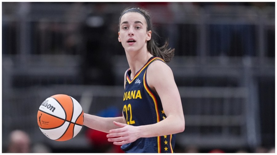 Indiana Fever guard Caitlin Clark (22) plays against the Los Angeles Sparks in the first half of a WNBA basketball game in Indianapolis, Tuesday, May 28, 2024. (AP Photo/Michael Conroy)