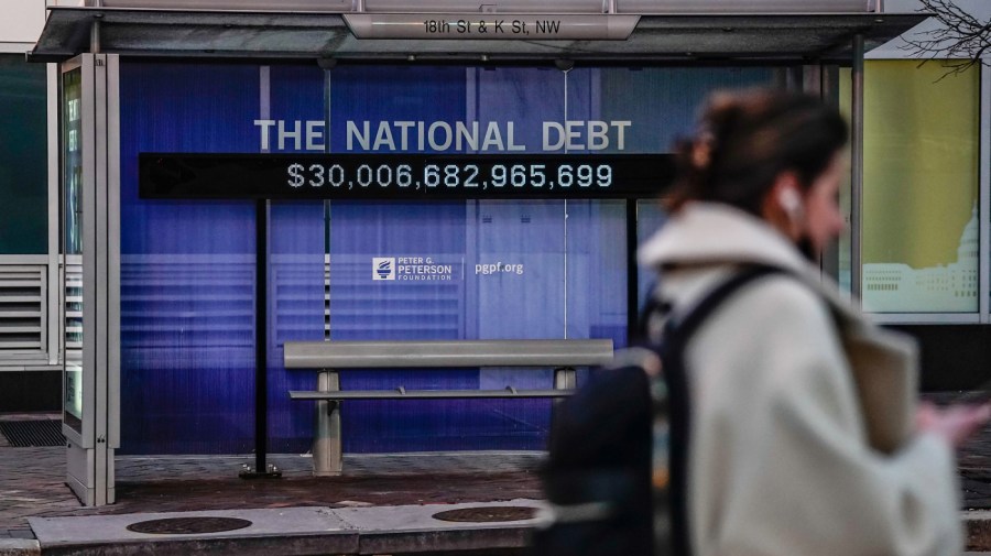 A Peterson Foundation billboard displaying the national debt is pictured on 18th Street in downtown Washington DC on February 08, 2022 in Washington, D.C.