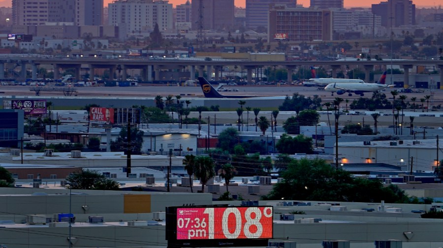 The unofficial temperature hits 108 degrees at dusk at Sky Harbor International Airport in Phoenix, on July 12, 2023. The U.S. last year saw the most heat waves since 1936, according to an Associated Press analysis of Centers for Disease Control and Prevention data. (AP Photo/Matt York, File)