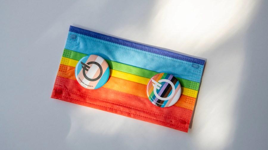 Colorful Pride rainbow face mask and pins on white background. (Photo by: Michael Siluk/UCG/Universal Images Group via Getty Images)