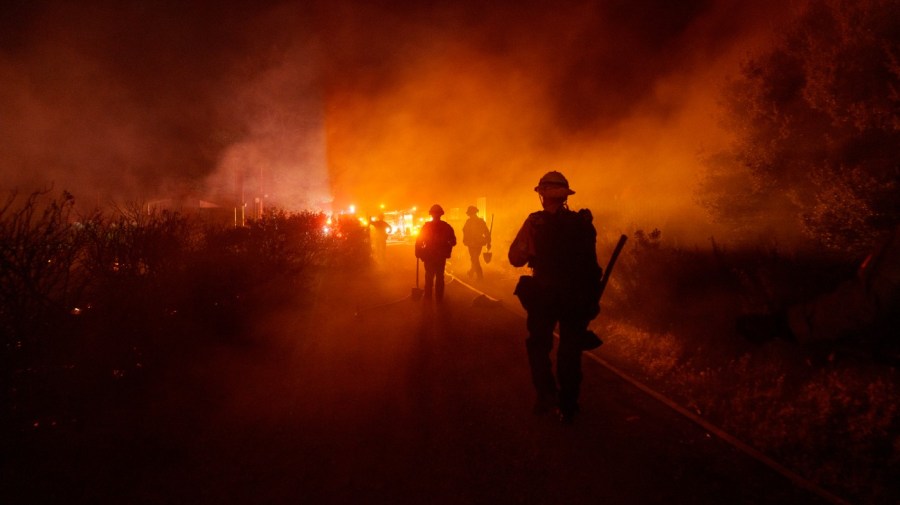 Firefighters work against the advancing Post Fire on Sunday, June 16, 2024, in Gorman, Calif. (AP Photo/Eric Thayer)