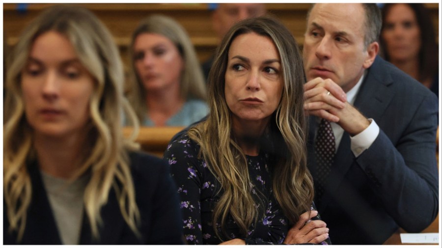 Karen Read listens during closing arguments during her trial at Norfolk Superior Court on Tuesday, June 25, 2024 in Dedham, Mass. Read is accused of killing her boyfriend Boston police Officer John O'Keefe, in 2022. (Nancy Lane/The Boston Herald via AP, Pool)